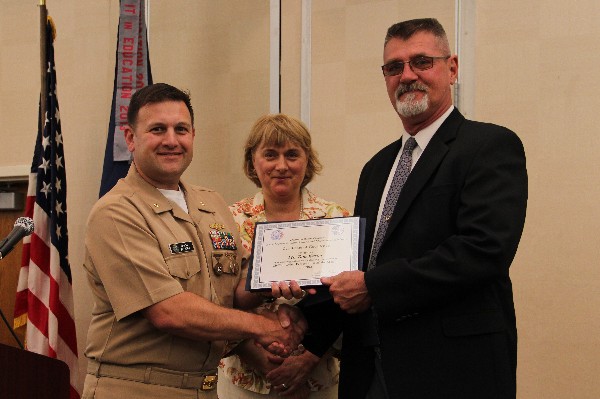 Lt. Cmdr. Pereira presents the June Civilian Cyber Professional of the Month to Tom Wester, Navy Cyber Forces. Duvall stands witness.